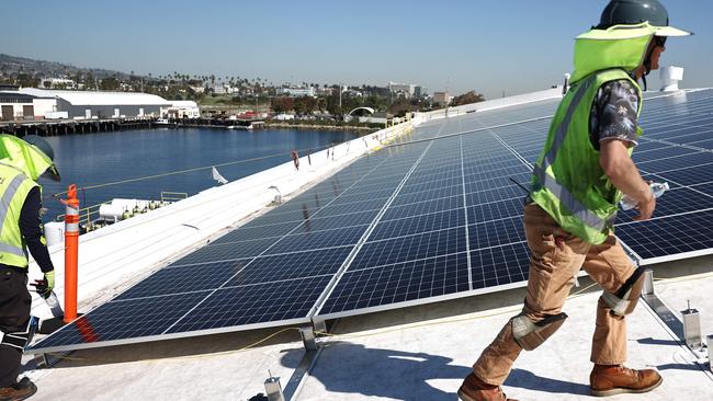 Households and businesses have been bolting on rooftop solar in record levels as they seek relief from two consecutive years of power bill increases of more than 20 per cent. Picture: AFP