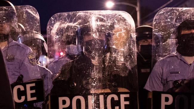 Police in riot gear face protesters marching through West Philadelphia on Tuesday during a demonstration against the fatal shooting of 27-year-old Walter Wallace. Picture: Gabriella Audi/AFP