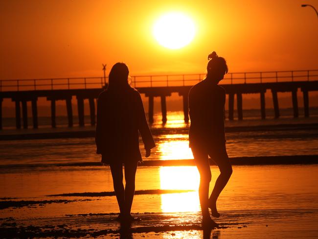 Melbourne began to heat up after sunrise. Picture: David Crosling