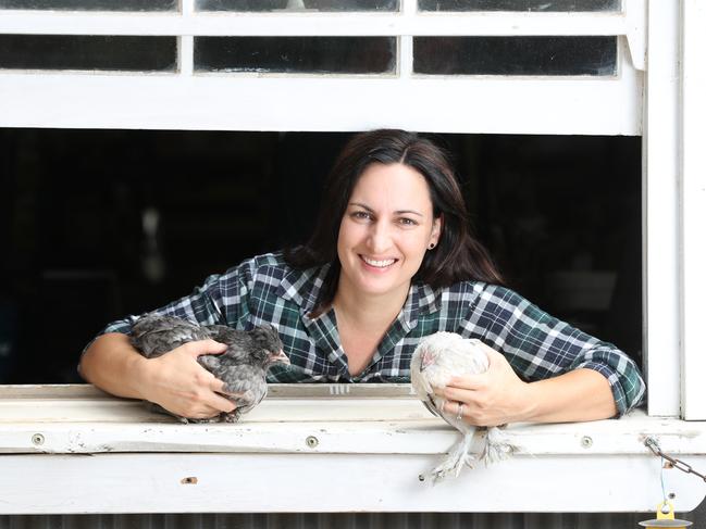 Vikki Threapleton at Sandersons Grain and Fodder with an olive egger and a Belgian d'uccle. Picture: Tait Schmaal