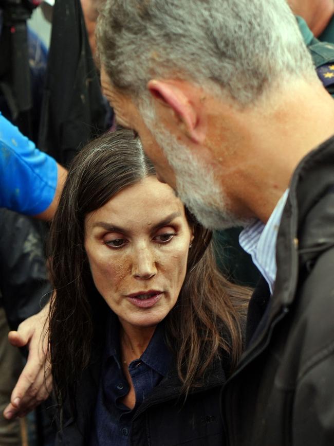 A visibly shaken Queen Letizia was heckled by the mob. Picture: AFP