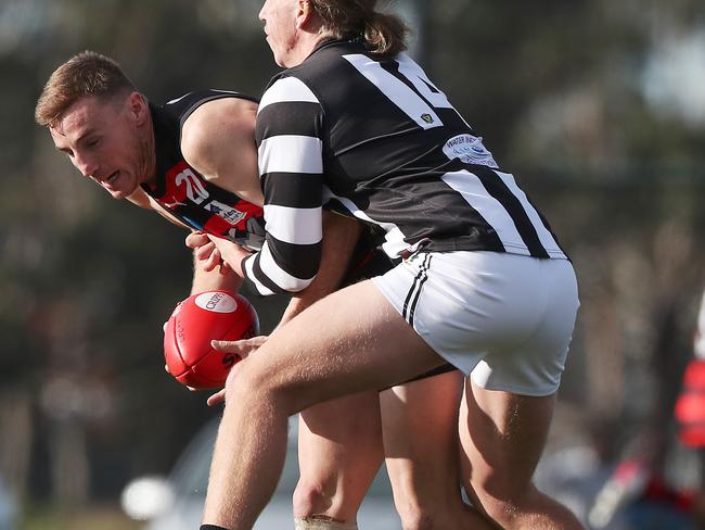 Glenorchy’s Isaac Manson wraps up Lauderdale’s Nicholas Raglione. Picture: Nikki Davis-Jones