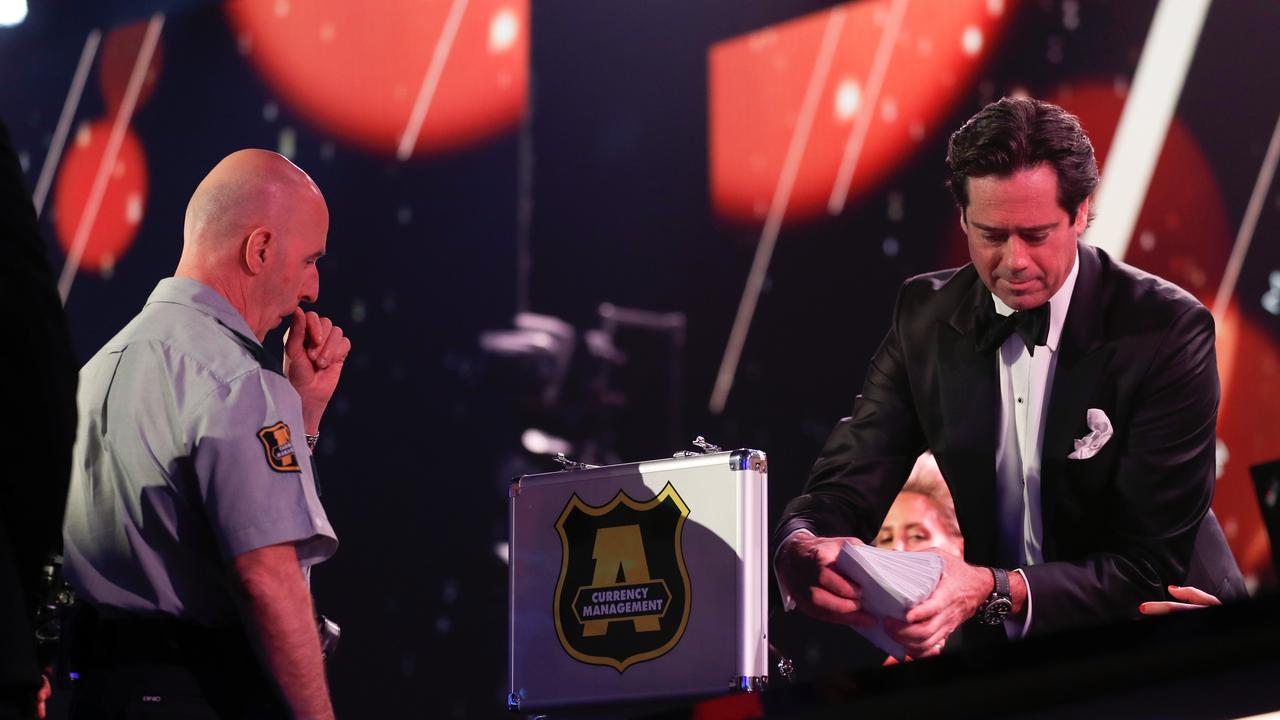 MELBOURNE, AUSTRALIA - SEPTEMBER 18: Gillon McLachlan, Chief Executive Officer of the AFL receives the votes from Armaguard during the 2022 Brownlow Medal at Crown Palladium on September 18, 2022 in Melbourne, Australia. (Photo by Michael Willson/AFL Photos via Getty Images)