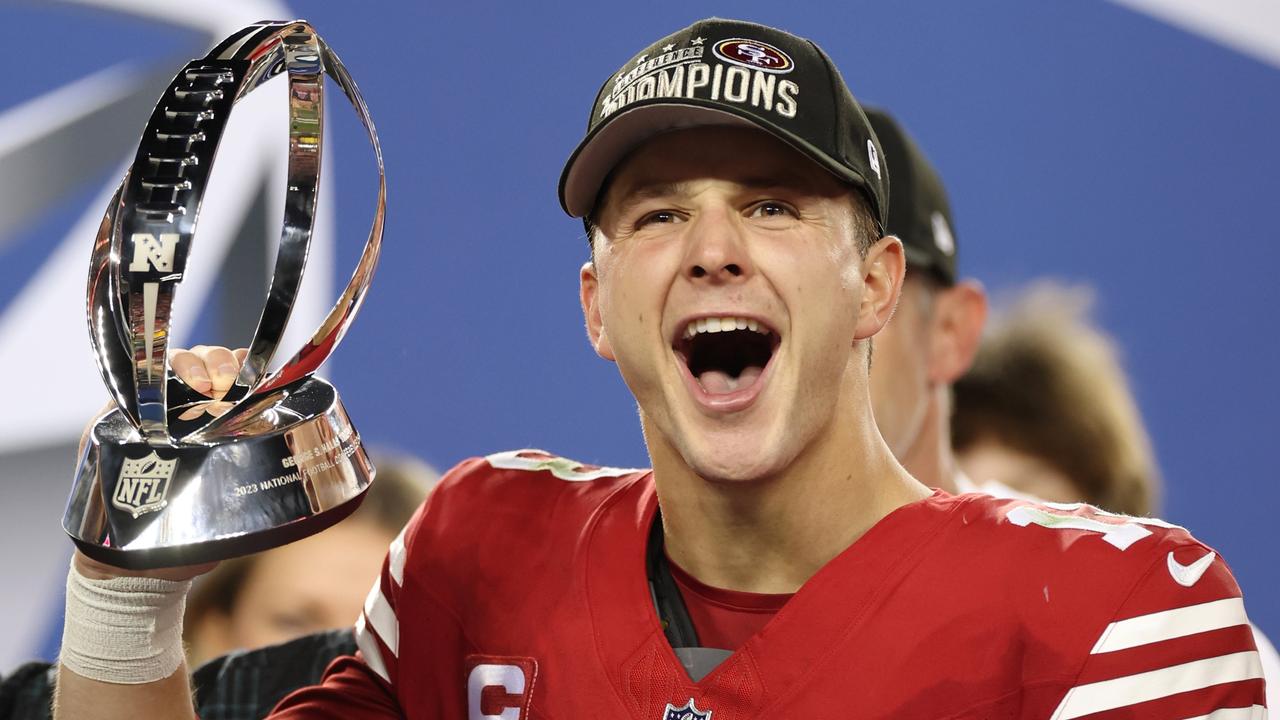 Brock Purdy reacts as he holds the George Halas Trophy after defeating the Detroit Lions 34-31 in the NFC Championship Game at Levi's Stadium. Picture: Getty