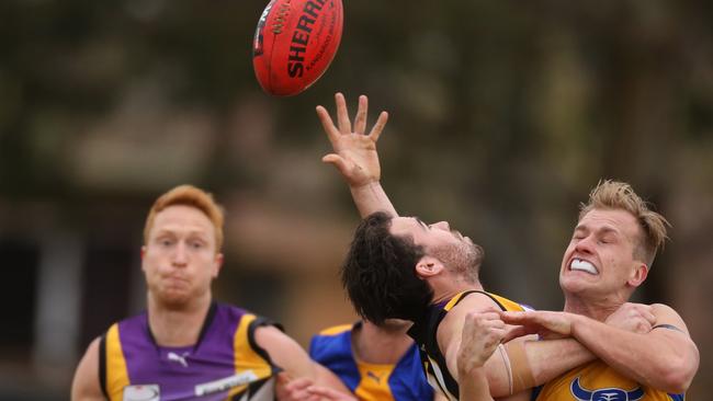 Norwood Jesse Newman and Noble Park’s Shane Allen vie for possession. Picture: Stuart Milligan.