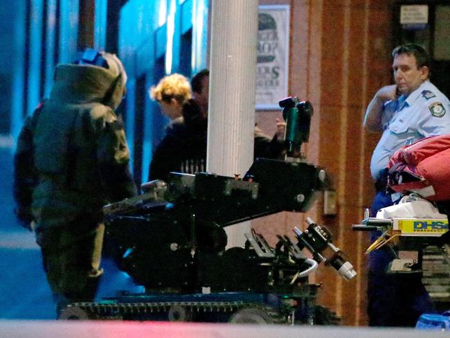 A Rescue and Bomb Disposal Unit officer and bomb robot prepare to enter Lindt Cafe. Daniel Munoz/Getty Images