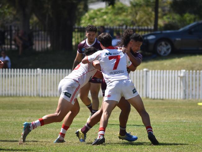 Xavier Sofeni is hit by Nicholas Quinn. Picture: Sean Teuma/NewsLocal