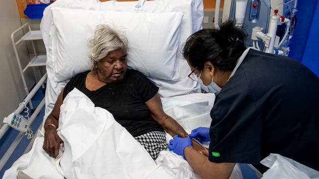 Diabetes and renal patient Julie Cline, who lives at the Little Sisters town camp in Alice Springs, receiving dialysis. Ms Cline says diabetes sufferers are dying waiting for dialysis chairs. Picture: Liam Mendes / The Australian