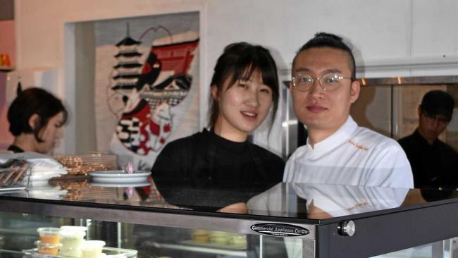 ON A ROLL: Jin Young Choi and Sung Ho Kim show off their sushi. Picture: DEIRDRE SMITH