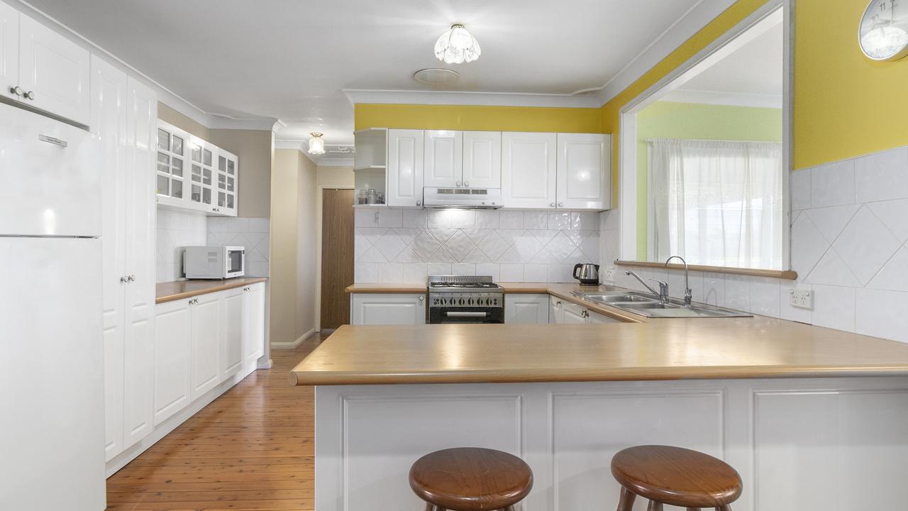 The home has a spacious kitchen with a breakfast bar.