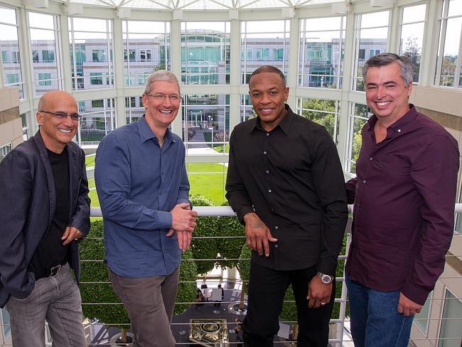 Music entrepreneur and Beats co-founder Jimmy Iovine, Apple CEO Tim Cook, Beats co-founder Dr. Dre, and Apple senior vice president Eddy Cue pose together at Apple headquarters in Cupertino, California. 