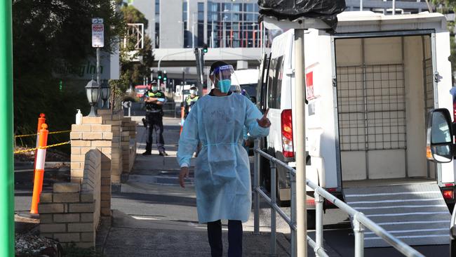 A worker at the hotel after the outbreak was revealed. Picture: NCA NewsWire/ David Crosling