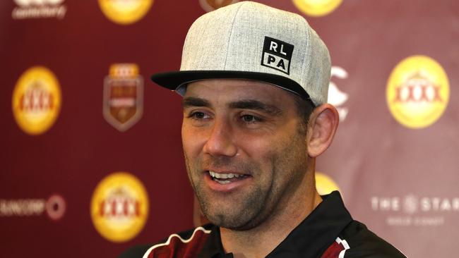 Maroons skipper Cameron Smith dons a RLPA cap at his media interview.