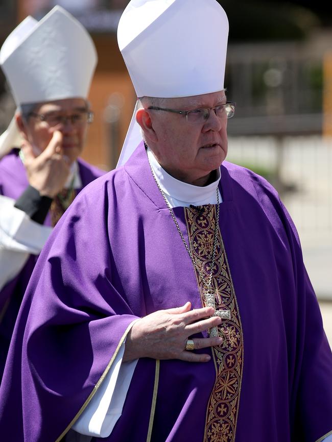 Archbishop of Brisbane Mark Coleridge was confronted by angry parents over the closure of Seton College at church. Picture: NCA NewsWire/Kelly Barnes