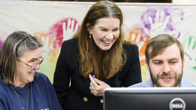 Groom Independent Suzie Holt (centre) looks over early numbers with Penelope Lilford and Thomas Murphy at campaign headquarters on federal election night, Saturday, May 3, 2025. Picture: Kevin Farmer