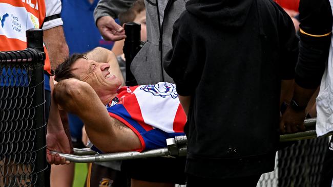 Brent Harvey is stretchered off the field after breaking his leg last year. Picture: Andy Brownbill