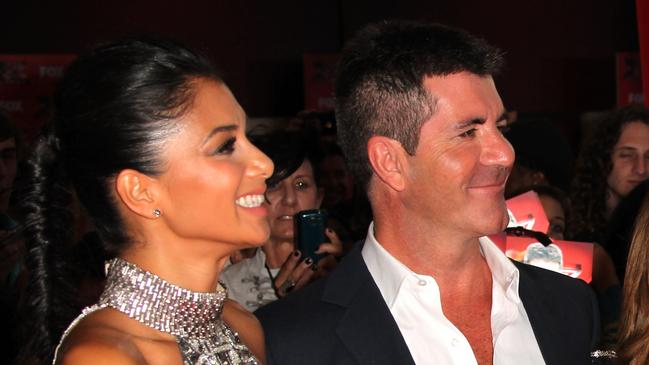 Television show judges (L-R) Nicole Scherzinger, Simon Cowell, Paula Abdul and LA Reid arrive at the premiere of Fox TV show 'The X Factor' at ArcLight Cinemas Cinerama Dome in Hollywood, California, 14/09/2011.