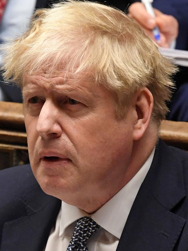 Boris Johnson reacts as Labour leader Keir Starmer (unseen) speaks in the Commons on Wednesday. Picture: UK Parliament / AFP