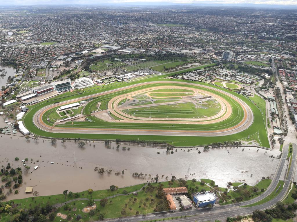 Aerial photos of flood waters enter homes and streets by the Maribyrnong River in the Flemington area. Flemington Racecourse under threat of rising flood water.                       Picture: David Caird