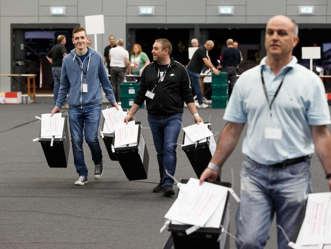 Ballot boxes are brought in to the counting at the Glasgow count centre at the Emirates Arena.