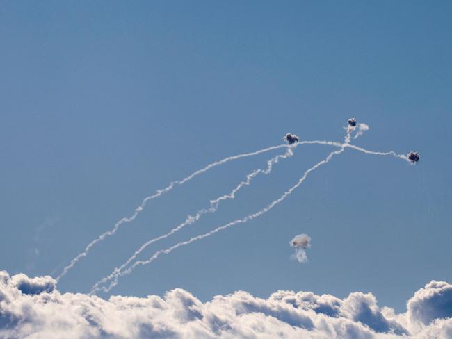 Rockets fired from southern Lebanon are intercepted by Israel's Iron Dome air defence system over the Upper Galilee region in northern Israel. Picture: AFP