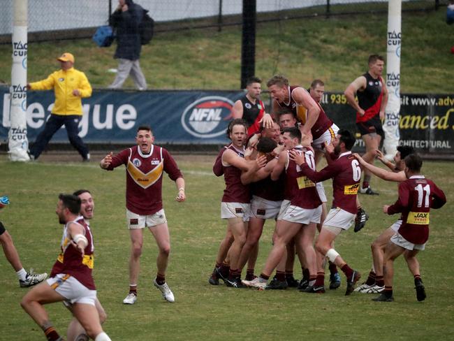 Ben Paterson of Lower Plenty celebrates a goal on the final siren with his teammates which won the NFL Division 2 grand final.