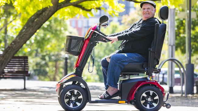 Reunited: Laurie Adams with his mobility scooter. Picture: Dylan Robinson