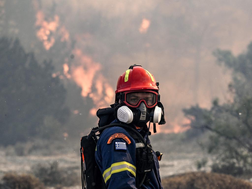 A firefighter looks on during a fire near the village of Vati, just north of the coastal town of Gennadi. Picture: AFP