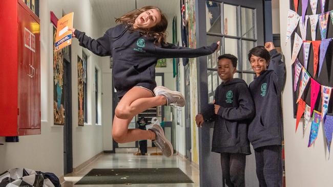 Marie, 11 Ethan, 12 and Aksha, 11 are excited that their school Flemington Primary will receive funding. Picture: Jason Edwards.