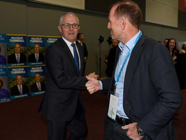 Prime Minister Malcolm Turnbull and former prime minister Tony Abbott speak during the NSW Liberal Party convention, at Rosehill Racecourse Picture: Dan Himbrechts.