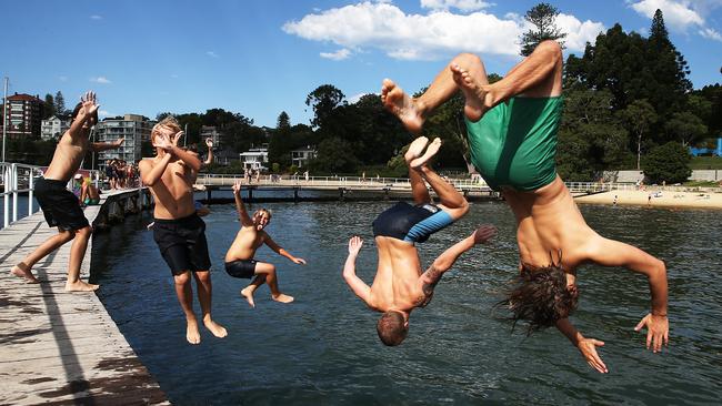 Indi Needham, 13, Johnny Hancock, 12, Dylan Buki, 12, Ollie Salmon, 23, and Finn Fowke, 23, cool off in the Murray Rose Pool at Woollahra on Monday. Picture: Jane Dempster