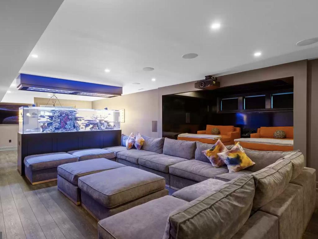 The movie room with a feature fish tank. Picture: Realtor