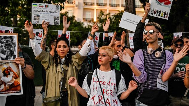 Young people take part in a demonstration to commemorate 40 days since the death of Iranian Mahsa Amini while in police custody in Iran, allegedly for not wearing her hijab properly.