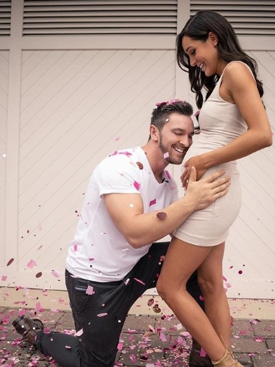 Kayla Itsines and Tobi Pearce reveal their new baby is going to be a girl. Pics: Instagram.