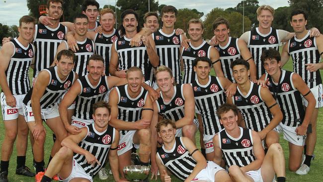 Port Adelaide players celebrate winning the Russell Ebert Tribute Match against West Adelaide at Loxton Oval. Picture: SANFL/Peter Argent.