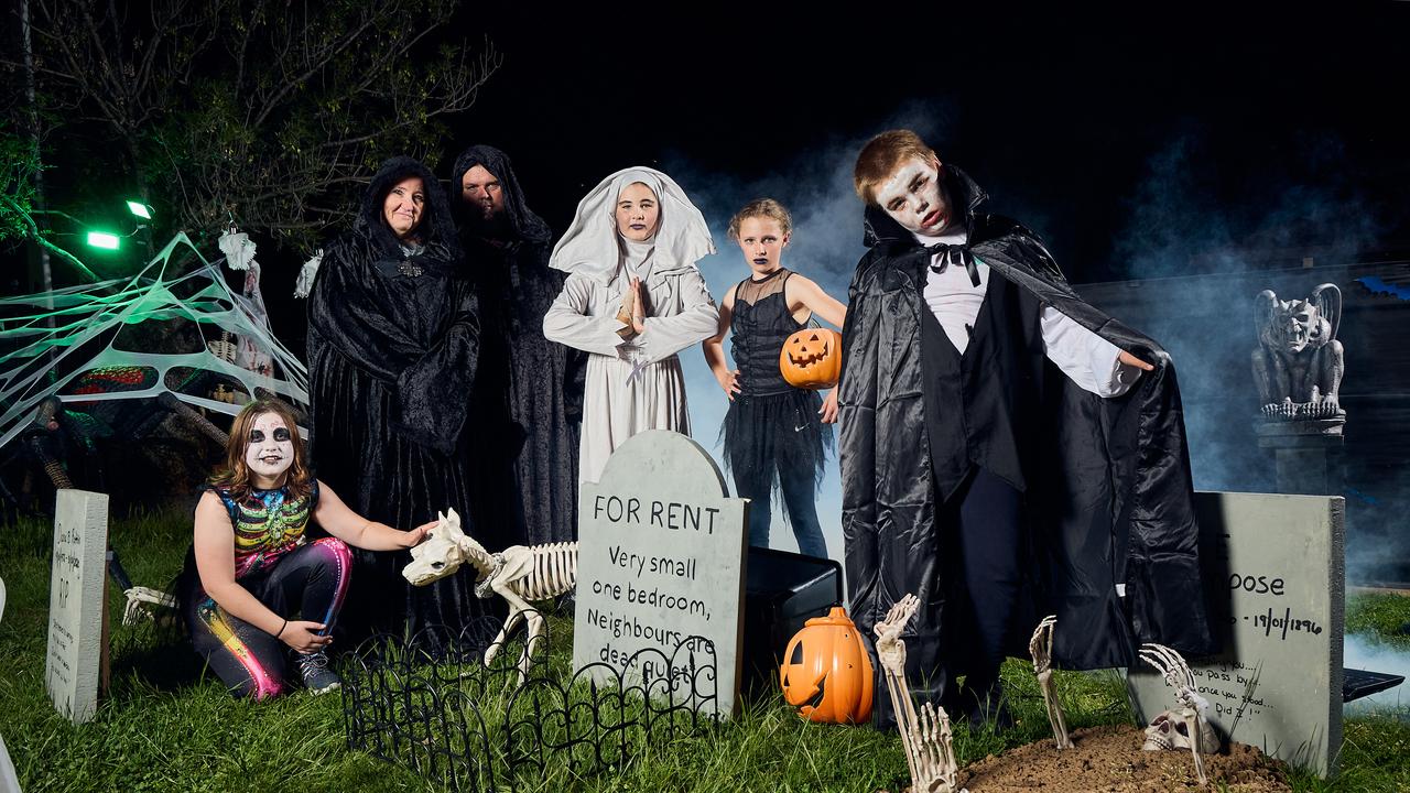 Addison Lynagh, 11, Adrian and Angela Webb, Kate Greatrex, 11, Jaiya Thornton, 12, and Will Greatrex, 8 at decorated Halloween House in Salisbury Downs, South Australia. Picture: Matt Loxton