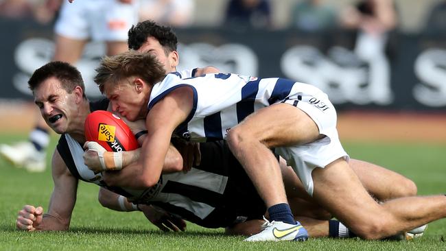 Wangaratta’s Daine Porter is tackled by Yarrawonga’s Jack Sexton. Picture Yuri Kouzmin