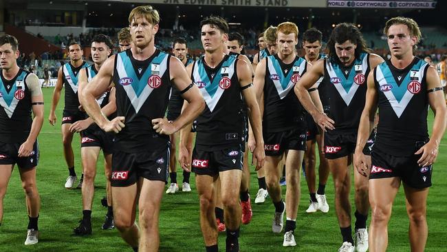 Tom Jonas leads his team off after their massive loss to the Hawks. Picture: Getty Images