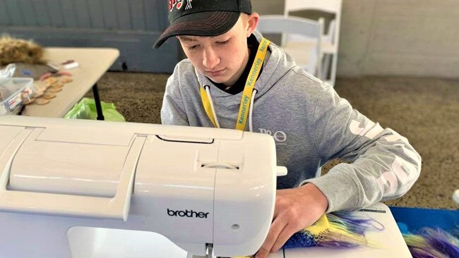 Campbell Remess busy making one of his colourful bears that bring smiles to the faces of sick people all over the world. Picture: Facebook