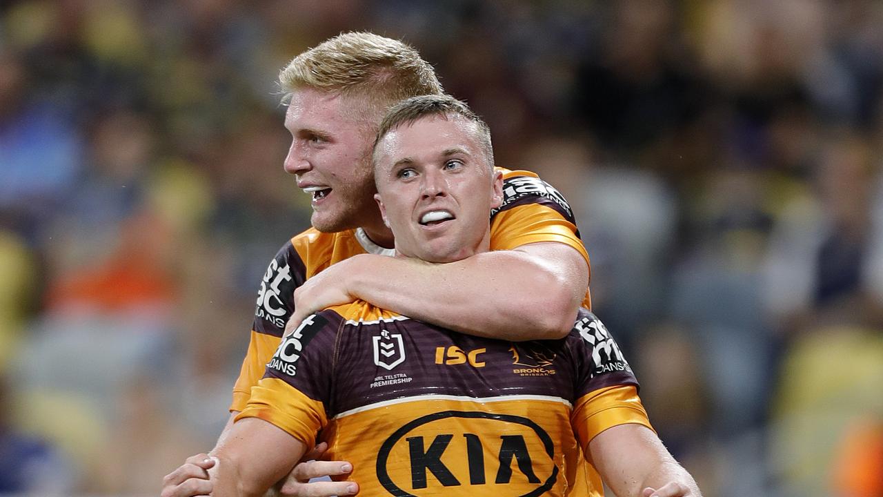 Thomas Flegler with Jake Turpin of the Brisbane Broncos