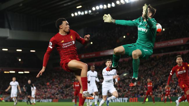 Trent Alexander-Arnold of Liverpool passes the ball past Lukasz Fabianski of West Ham United for Sadio Mane of Liverpool to scores his side’s third goal Picture: Getty Images