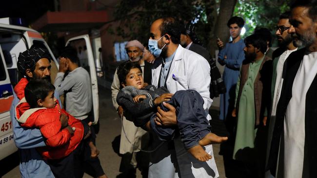 Young victims from the disaster zone are brought to hospital in Herat City on Sunday. Picture: Reuters