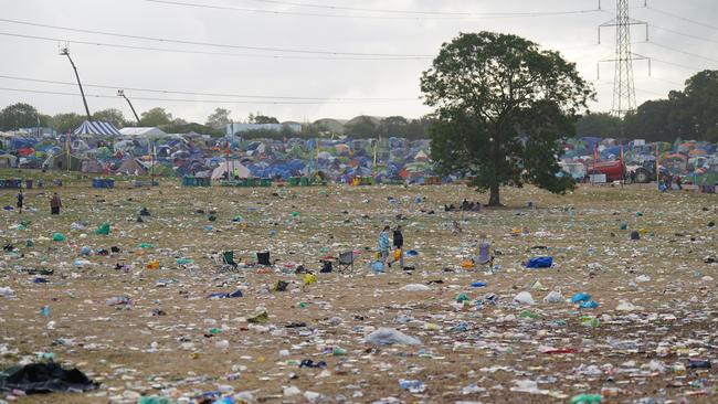 Volunteers arrived after the festival to help with the mess. Picture: Yui Mok/PA Wire