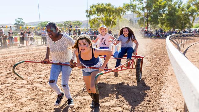 Competitors in the gruelling Rickshaw Iron Man Challenge at the Alice Springs Camel Cup. Picture: EMMA MURRAY