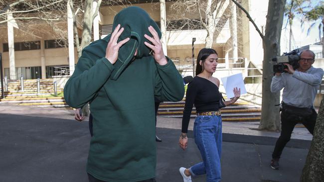 Justyn Desnica and his sister Hayley Desnica leaving Surry Hills Police Station on Sunday. Picture: Justin Lloyd