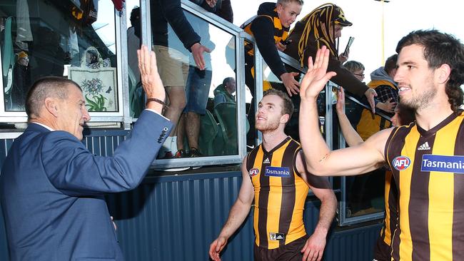 Kennett gives defender Ben Stratton a high-five after the Hawks beat the Gold Coast. Pic: Getty Images