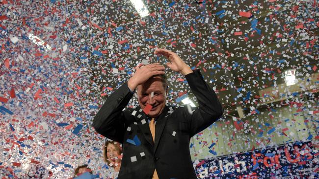 Confetti rains down on John Kasich after he won the winner-takes-all state of Ohio. Picture: AFP/Brendan Smialowski