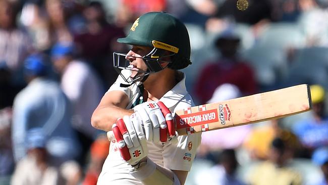 Australia's Joe Burns hits out against the Indian bowling on the third day of the first Test in Adelaide