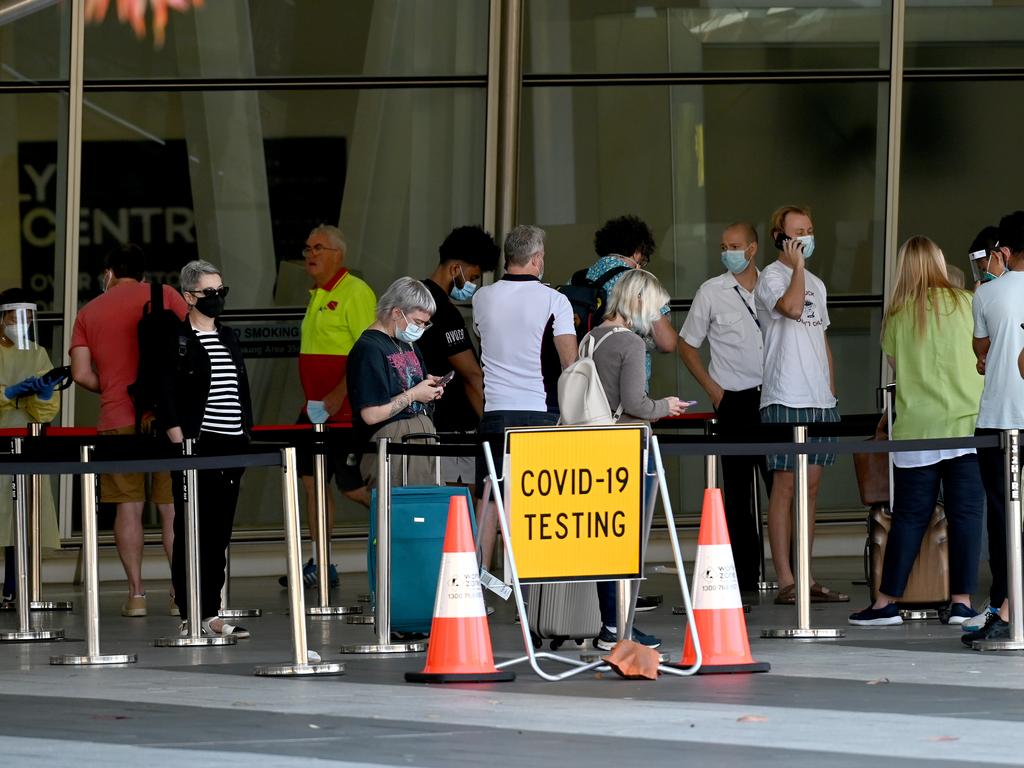 Travellers line up to get tested for Covid outside of Adelaide Airport. Picture: NCA NewsWire / Naomi Jellicoe