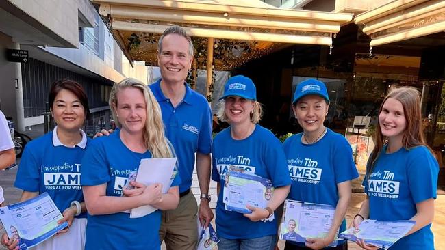 Liberal MP Tim James pictured with supporters in the state seat of Willoughby.